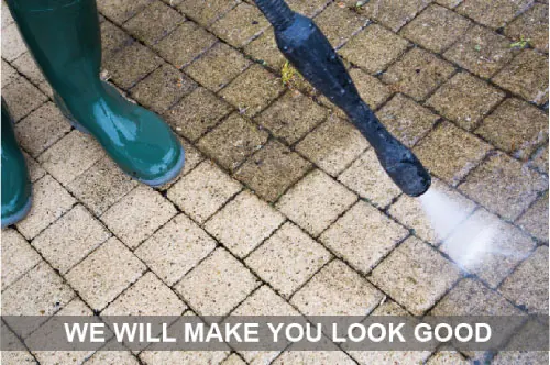Pressure washer cleaning paving stones